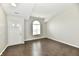 Bright living room featuring sleek flooring, vaulted ceilings, and a modern arched window at 6591 Rushing, Noblesville, IN 46062