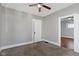 Neutral bedroom featuring a ceiling fan, carpet and trim at 67 S 9Th Ave, Beech Grove, IN 46107