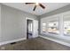 Sunlit bedroom with carpet, ceiling fan, and bright windows at 67 S 9Th Ave, Beech Grove, IN 46107