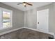 Cozy bedroom featuring a ceiling fan and a window with natural light at 67 S 9Th Ave, Beech Grove, IN 46107