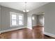 Cozy dining area features hardwood floors, fresh paint and bright window at 67 S 9Th Ave, Beech Grove, IN 46107