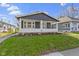 Delightful home with a spacious covered porch, offering a perfect spot for relaxation and enjoying the outdoors at 67 S 9Th Ave, Beech Grove, IN 46107