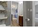 Hallway leading into kitchen with view of shelves and bathroom at 67 S 9Th Ave, Beech Grove, IN 46107