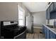 Well-equipped kitchen boasts stainless steel refrigerator and gas range at 67 S 9Th Ave, Beech Grove, IN 46107