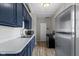 Modern kitchen includes dark blue cabinets, stainless steel sink and modern appliances at 67 S 9Th Ave, Beech Grove, IN 46107