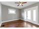 Cozy living space featuring wood floors, complemented by fresh paint and natural light, creating a comfortable ambiance at 67 S 9Th Ave, Beech Grove, IN 46107