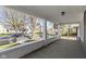 Covered porch features sturdy columns and a view of the peaceful street, ideal for outdoor relaxation at 67 S 9Th Ave, Beech Grove, IN 46107