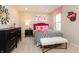 Bright bedroom designed with a playful theme, modern accents, and a stylish furniture arrangement at 7076 Portico Ln, McCordsville, IN 46055