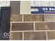 Selection of exterior finishes with brick, stone, siding and a shutter at 7076 Portico Ln, McCordsville, IN 46055