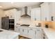 Bright kitchen with white cabinetry, stainless steel appliances, and a marble countertop at 7076 Portico Ln, McCordsville, IN 46055