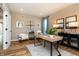 Bright office space with wood floors, a modern desk, and a comfortable chair at 7076 Portico Ln, McCordsville, IN 46055