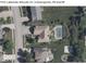 Aerial view of a property with a backyard pool and well-maintained landscaping at 7113 Lakeside Woods Dr, Indianapolis, IN 46278