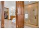 This bathroom has a walk-in shower with glass door, soaking tub, and a walk-in closet at 7113 Lakeside Woods Dr, Indianapolis, IN 46278