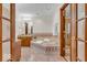 This primary bath has a soaking tub with tile surround and vanity with a framed mirror at 7113 Lakeside Woods Dr, Indianapolis, IN 46278