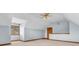 Unfurnished bonus room featuring carpet, a ceiling fan, a window, and fresh, light blue paint at 7113 Lakeside Woods Dr, Indianapolis, IN 46278