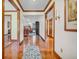 Elegant foyer with hardwood floors leading to a cozy living space and an interior corridor at 7113 Lakeside Woods Dr, Indianapolis, IN 46278