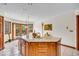 Kitchen island with breakfast nook and sliding doors to the back deck at 7113 Lakeside Woods Dr, Indianapolis, IN 46278