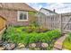 Beautifully landscaped yard with flowers and greenery around the brick home at 7113 Lakeside Woods Dr, Indianapolis, IN 46278