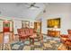 Inviting living room with hardwood floors, fireplace, and abundant natural light from several windows at 7113 Lakeside Woods Dr, Indianapolis, IN 46278