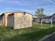 Fenced backyard showcasing a storage shed with the main house in the background at 760 E Walnut St, Martinsville, IN 46151