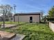 Well-kept backyard featuring a storage shed with a fenced perimeter at 760 E Walnut St, Martinsville, IN 46151