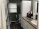 This bathroom has a white vanity, toilet, cabinets, and fixtures at 760 E Walnut St, Martinsville, IN 46151