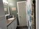 This bathroom has a white vanity, toilet, cabinets, and fixtures at 760 E Walnut St, Martinsville, IN 46151