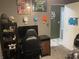 This bedroom has decor, a gaming chair, a desk, and gray walls at 760 E Walnut St, Martinsville, IN 46151