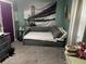 This cozy bedroom has a gray daybed, gray carpet, and decor at 760 E Walnut St, Martinsville, IN 46151