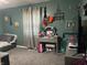 This cozy bedroom has a gray daybed, gray carpet, a vanity, and decor at 760 E Walnut St, Martinsville, IN 46151