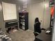 This bedroom features a bed with patterned bedding and shelves for storage at 760 E Walnut St, Martinsville, IN 46151