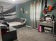 This cozy bedroom has a gray daybed, gray carpet, a vanity, and decor at 760 E Walnut St, Martinsville, IN 46151