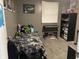 This bedroom features a bed with patterned bedding and shelves for storage at 760 E Walnut St, Martinsville, IN 46151