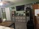 Bedroom with large TV, storage cube shelving and plenty of decorative wall art at 760 E Walnut St, Martinsville, IN 46151