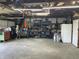 Open garage space offering plenty of room for storage with convenient overhead lighting at 760 E Walnut St, Martinsville, IN 46151