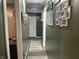 Hallway with decorative wall art and a neutral color runner rug at 760 E Walnut St, Martinsville, IN 46151