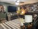 Inviting living room featuring a large TV and comfortable seating area at 760 E Walnut St, Martinsville, IN 46151