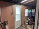 Storage room with a frosted glass door, shelves, and storage bins at 760 E Walnut St, Martinsville, IN 46151