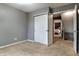 Cozy bedroom with neutral carpet, closet, and easy access to the home's other levels at 7775 Hollow Ridge Cir, Indianapolis, IN 46256