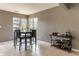 Cozy dining area with a table and chairs, with natural light from the windows, and a bar cart at 7775 Hollow Ridge Cir, Indianapolis, IN 46256
