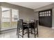 Casual dining area featuring a table with chairs and a sliding barn door at 7775 Hollow Ridge Cir, Indianapolis, IN 46256