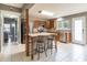 Spacious kitchen with a tiled island, bar seating, stainless steel appliances, and ample cabinetry at 7775 Hollow Ridge Cir, Indianapolis, IN 46256