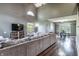 Open-concept living room featuring vaulted ceilings, hardwood floors, and a comfortable seating area at 7775 Hollow Ridge Cir, Indianapolis, IN 46256