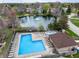 An aerial view of the community pool area, featuring a large pool, a small spa, and lounge seating at 7775 Hollow Ridge Cir, Indianapolis, IN 46256