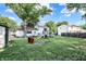 Expansive backyard featuring a playset, mature trees, and plenty of room for recreation and outdoor enjoyment at 7915 Broadview Dr, Indianapolis, IN 46227