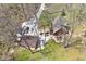 Aerial view of the house, driveway, yard, pond, and detached garage at 8327 S County Road 825 E, Plainfield, IN 46168