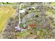 An aerial view shows a home site with a beautiful pond in a wooded area at 8327 S County Road 825 E, Plainfield, IN 46168