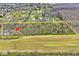 An aerial view displays the landscape of the lot with mature trees in a desirable location at 8327 S County Road 825 E, Plainfield, IN 46168
