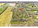 An aerial view displays the landscape of the lot with mature trees in a desirable location at 8327 S County Road 825 E, Plainfield, IN 46168