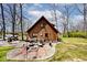 Spacious backyard with patio, seating, and manicured landscaping at 8327 S County Road 825 E, Plainfield, IN 46168